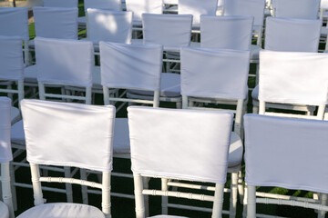 Rows of white chairs mockup with blank fabric. High quality photo