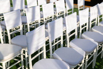 Rows of white chairs mockup with blank fabric. High quality photo