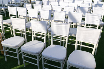 Rows of white chairs mockup with blank fabric. High quality photo