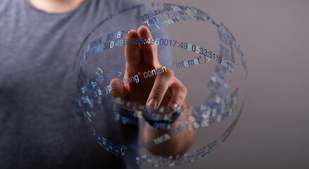 A person touching a digital sphere with data and information, symbolizing technology, the internet, and the future. Great for tech, d