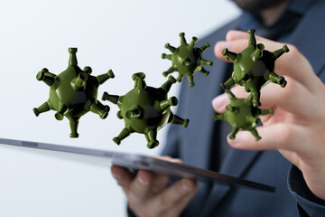 Conceptual illustration of digital viruses and malware over the internet. A person is holding a tablet with co