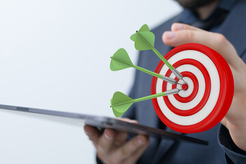 Image of darts hitting the bullseye, concept of business success, goals achieved, and targets...