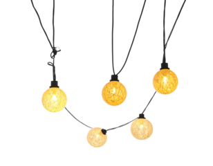 Glowing string lights hanging against a black background. Warm white bulbs brighten a dark room