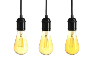 Three illuminated pear-shaped light bulbs hanging from black cords against a black background