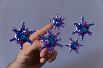 Abstract image showing hand interacting with coronavirus. Visualizing disease, illness, medical...