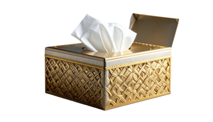 A decorative tissue box, gold in color, with ornate patterns and a single tissue visible