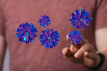 Digitally rendered crystal spheres interacting with a human finger, conveying connection and...