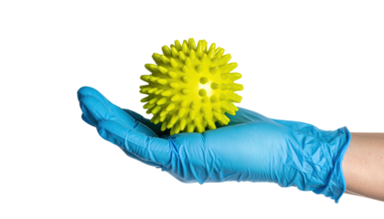 A gloved hand cradles a yellow, spiky sphere against a black background