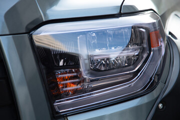 Fototapeta premium Modern pickup truck LED headlight detail.