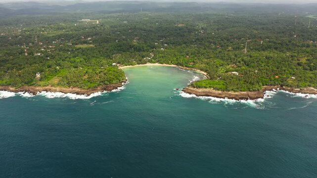 Aerial drone of beach in the bay, a place for surfing. Hiriketiya beach, Sri Lanka.
