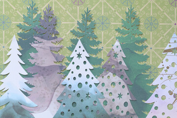 variety of machine-cut holiday trees on decorative paper