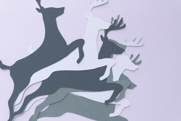 leaping reindeer paper shapes on blank paper