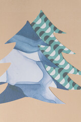 abstract holiday trees machine-cut from marbled blue and geometric pattern scrapbooking paper