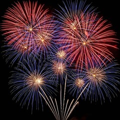 Fototapeta premium Stunning Red and Blue Fireworks Display Exploding in the Night Sky