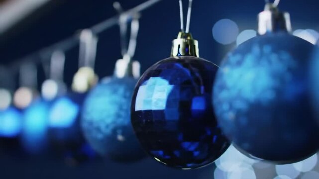 Christmas ornaments hanging, in a row