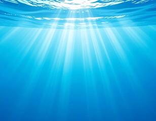 An underwater view shows the surface and ethereal light rays penetrating the blue water. The sun's light streams downward
