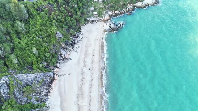 Aerial Drone View of Hidden Beach with Granite Rocks and Blue Water