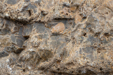 Close-up of stone surface. Brown stone texture, background.