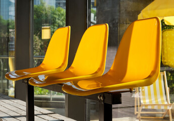 yellow plastic seats in a playground