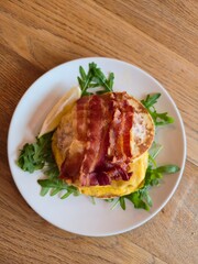 English Muffin Breakfast with Bacon and Arugula
