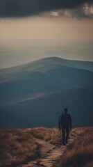Obraz premium footstep. Lone traveler with backpack on narrow misty mountain trail. tourism brochures, itinerary planners, destination guides, designed for travel destination branding, used by travel agents.