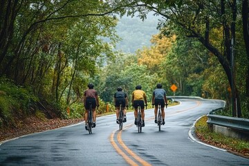 four cyclists riding on a wet winding forest road under overcast sky, wearing helmets and colorful jerseys, conveying camaraderie, focus and quiet determination