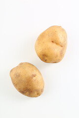 Fototapeta premium Fresh Potatoes On Clean Studio Background