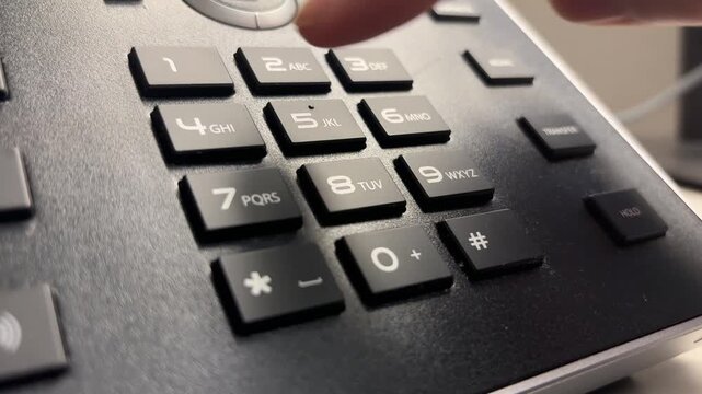 Slow Motion Close-Up of Index Finger Dialing 9-1-1 on Push-Button Phone