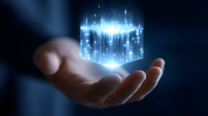 Enigmatic Tech Luminescence: A human hand cradles a radiant, glowing cube, symbolizing innovation, futuristic technology, and the digital frontier.