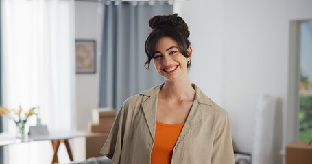 Property, portrait and woman in house with confidence, fresh start and investment in dream home. Success, real estate and girl in living room with pride, relocation and achievement for new homeowner