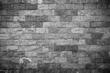 Gray brick wall texture dark background