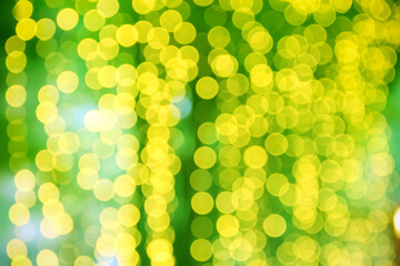 Yellow bokeh glitter hamper patterns on green christmas background