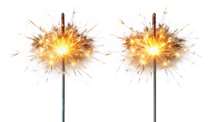 Glowing sparklers illuminate a dark background emitting bright sparkling light
