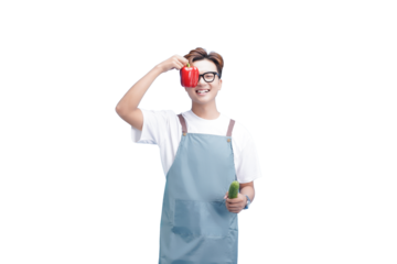 Chef's Fresh Take: A cheerful chef playfully poses, holding a vibrant red pepper to one eye and a refreshing cucumber in the other hand, celebrating fresh ingredients.