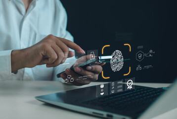 Biometric authentication and data protection concept with businessman using smartphone over laptop, fingerprint scan security, digital identity verification, fintech and cyber security technology.
