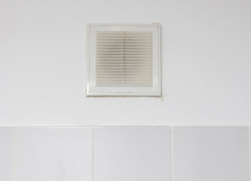 a dust-clogged ventilation mesh in a room
