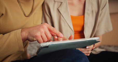 Tablet, scrolling and hands of couple in home with relax for communication, social media or contact. Digital technology, bonding and man with woman for texting, connectivity or research on app.