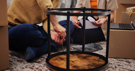 Furniture, hands or couple in house with assemble, help or bonding in home setup. Teamwork, diy project or people in living room with building, installation together or support in interior decoration