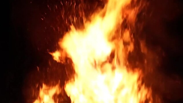 Intense flames leaping against darkness