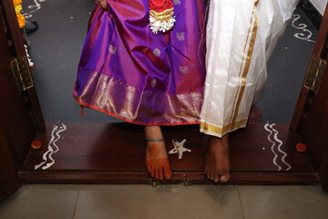 indian couple entering home
