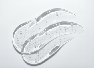Fototapeta premium Clear Gel Swirls with Bubbles on White Background.