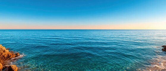Serene Coastal Landscape with Calm Blue Ocean and Clear Sky