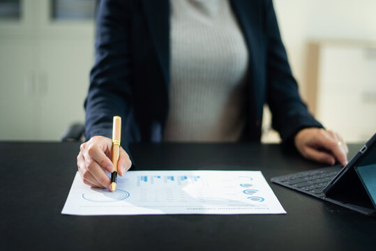 businesswoman using a stylus with digital tablet in modern office. Concept of smart technology, remote work - Powered by Adobe