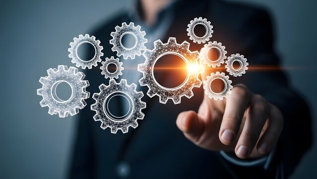 Businessman interacting with glowing digital gears representing business processes and technology