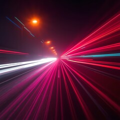 Vibrant red and white light trails on a dark road at night, abstract speed and motion concept with colorful streaks