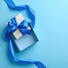 Open gift box with blue ribbon on a bright blue background