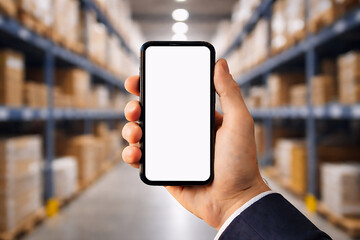 Ecommerce Warehouse Management Concept &ndash; Hand Holding Smartphone With Blank Screen in Fulfillment Center