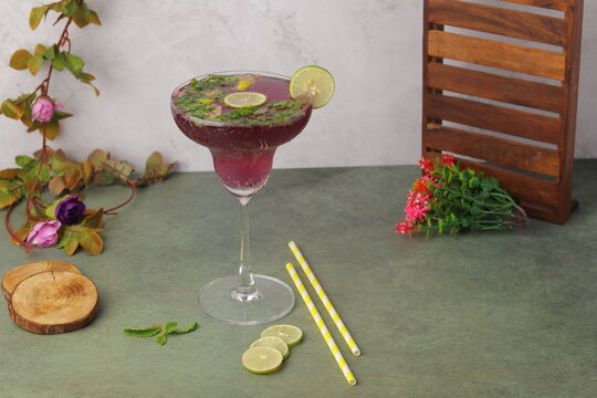 Refreshing jamun mojito made with fresh Indian blackberry (jamun), mint leaves, lime, and soda, served chilled with ice. A vibrant Indian fusion mocktail known for its deep purple color and sweet-tang
