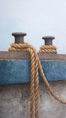 Exploring Nautical Dynamics: A Stunning Close-up of Mooring Ropes and Bollards with Artistic Detail