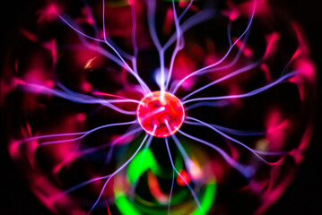 Colorful plasma lamp experiment on a black background